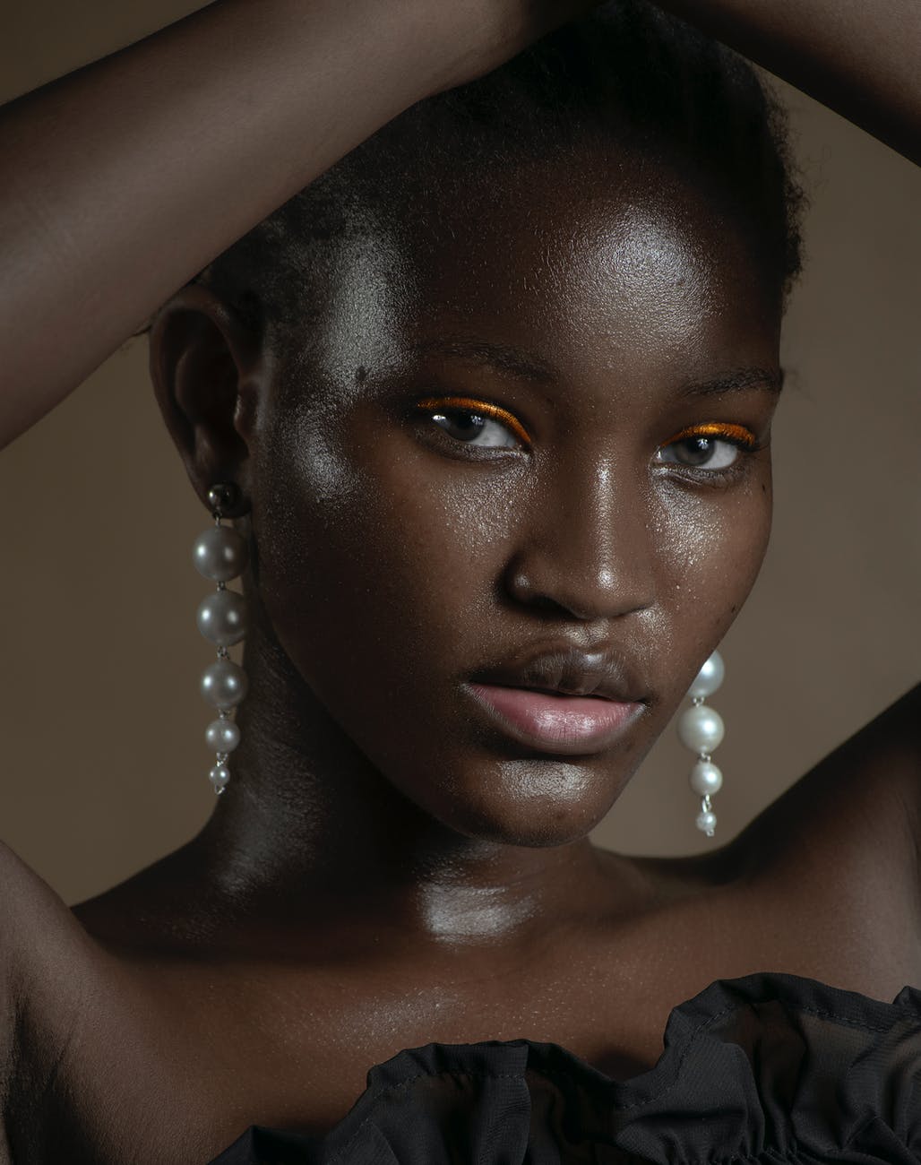 gorgeous black woman with pearl earrings