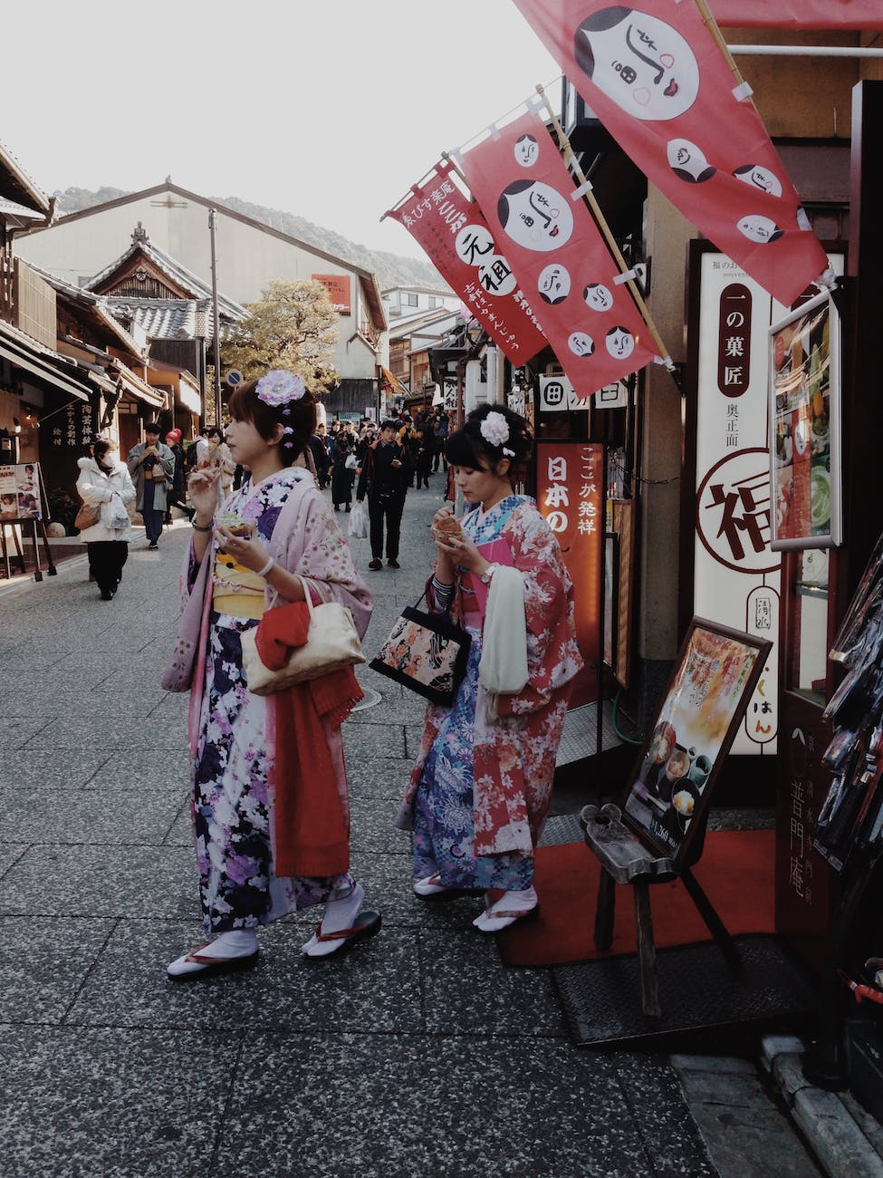 two women in yukata near market