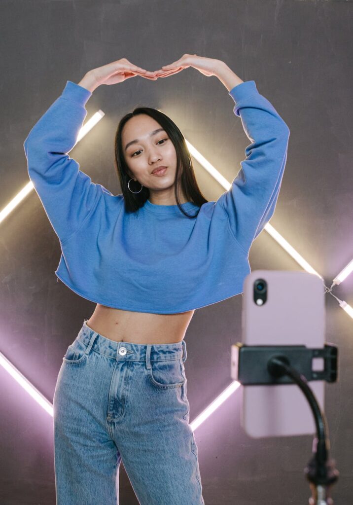 woman in blue long sleeve shirt and blue denim jeans