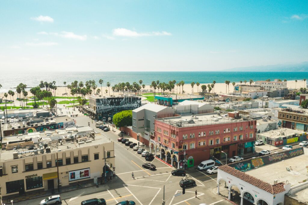 aerial view of concrete buildings near ocean