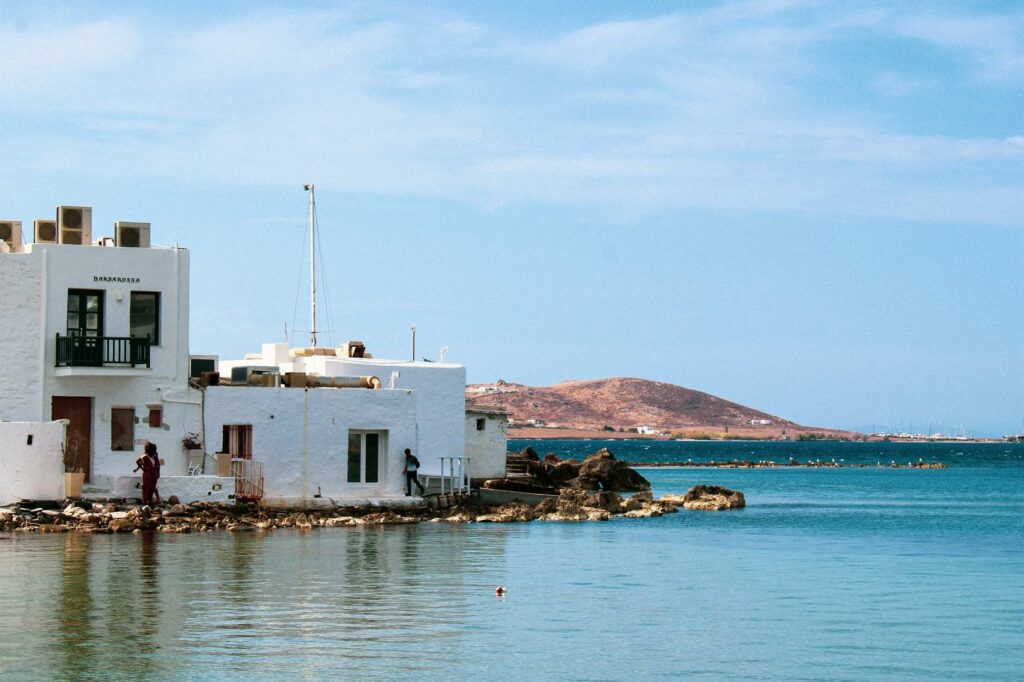 white concrete buildings on a shore